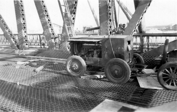 Harry Francel's welder on High St. Bridge, Oakland, 1939
